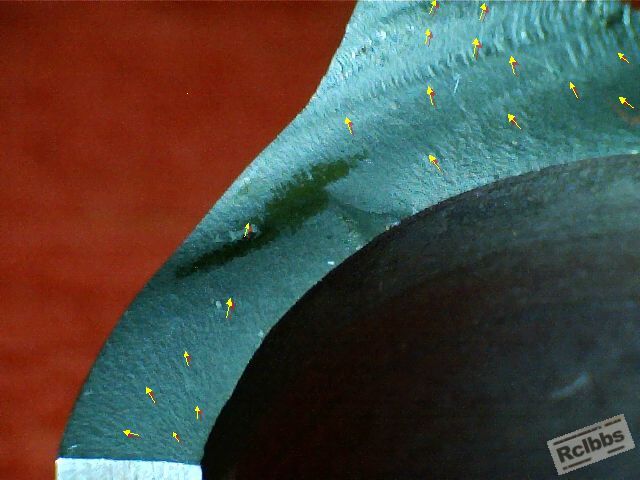 Arrows showing directions of crack propagation.