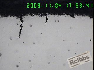 100X螺母断裂口处附近两条裂纹呈垂直向,里层延伸,(横截面),.jpg